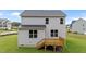 Backyard with a wooden deck and lush green lawn, perfect for outdoor living at 20 Diamond Creek Dr, Zebulon, NC 27597