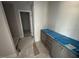 Bathroom with gray cabinetry, modern countertops, and walk-in shower at 20 Diamond Creek Dr, Zebulon, NC 27597