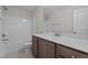 Bright, clean bathroom with white tub and shower and quartz vanity at 20 Diamond Creek Dr, Zebulon, NC 27597