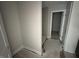 Bathroom featuring tiled shower, neutral walls, and gray cabinetry at 20 Diamond Creek Dr, Zebulon, NC 27597