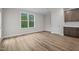 Bright bedroom with large window, neutral paint, and complementing flooring and cabinetry at 20 Diamond Creek Dr, Zebulon, NC 27597