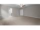 Neutral bedroom with light carpet and fan; doorway leads to bathroom and closet at 20 Diamond Creek Dr, Zebulon, NC 27597