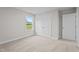 Neutral bedroom with a double-door closet and window overlooking a field at 20 Diamond Creek Dr, Zebulon, NC 27597