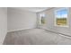 Bright bedroom with two windows offering natural light and neutral carpet and paint at 20 Diamond Creek Dr, Zebulon, NC 27597