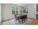 Cozy dining area with a large window, elegant furniture, and plenty of natural light at 20 Diamond Creek Dr, Zebulon, NC 27597
