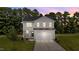 Charming two-story home with a well-manicured lawn and a spacious two car garage at 20 Diamond Creek Dr, Zebulon, NC 27597