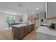 Spacious kitchen featuring a large center island, stylish pendant lighting, and modern appliances at 20 Diamond Creek Dr, Zebulon, NC 27597
