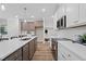 Spacious kitchen featuring a large center island, stylish pendant lighting, and modern appliances at 20 Diamond Creek Dr, Zebulon, NC 27597