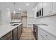 Modern kitchen with stainless steel appliances, a large island and stylish pendant lighting at 20 Diamond Creek Dr, Zebulon, NC 27597