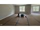 Spacious living area with large windows providing ample natural light, neutral paint, and molding at 20 Diamond Creek Dr, Zebulon, NC 27597