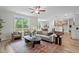 Open concept living area with view to a deck, the dining room, and a modern kitchen at 20 Diamond Creek Dr, Zebulon, NC 27597