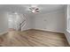 Bright living room with neutral walls and floors and featuring a staircase at 20 Diamond Creek Dr, Zebulon, NC 27597