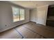 Cozy living room with a large window offering natural light and neutral walls at 20 Diamond Creek Dr, Zebulon, NC 27597