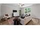 Inviting living room with comfortable seating, stylish decor, and a large window offering scenic views at 20 Diamond Creek Dr, Zebulon, NC 27597