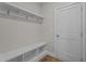 Mudroom featuring a built-in bench with storage and coat hooks for organization at 20 Diamond Creek Dr, Zebulon, NC 27597