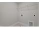 A utility room with tile flooring and basic hookups provides functionality at 20 Diamond Creek Dr, Zebulon, NC 27597