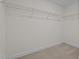 Walk-in closet with carpeted floor and adjustable wire shelving at 20 Diamond Creek Dr, Zebulon, NC 27597