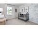 Bright Bedroom featuring a black crib and floral wallpaper at 2148 Monk Dr, Haw River, NC 27258