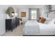Cozy bedroom offers a neutral color scheme and a serene ambiance at 2148 Monk Dr, Haw River, NC 27258