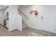 Welcoming entryway adjacent to the kitchen, featuring a staircase and modern fixtures at 2148 Monk Dr, Haw River, NC 27258