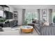 Stylishly decorated living room with comfortable seating and modern shelving units at 2148 Monk Dr, Haw River, NC 27258