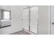 Bright bathroom featuring a glass enclosed shower and a doorway to the bedroom at 2168 Monk Dr, Haw River, NC 27258