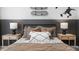 Close-up of modern ' bedroom with pillows and two side tables with lamps at 2168 Monk Dr, Haw River, NC 27258