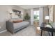Bright bedroom featuring a desk, stylish fixtures, curtains, and neutral carpet at 2168 Monk Dr, Haw River, NC 27258