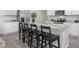 Modern kitchen island with counter seating and sleek appliances at 2168 Monk Dr, Haw River, NC 27258