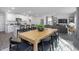 Spacious open layout connecting the kitchen, dining area, and living room with modern decor at 2168 Monk Dr, Haw River, NC 27258
