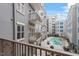 Balcony overlooking the pool and nearby buildings, providing a serene outdoor space at 222 Glenwood Avenue # 218, Raleigh, NC 27603