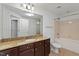 Bathroom featuring granite counters, tile flooring, and a shower-tub combination at 222 Glenwood Avenue # 218, Raleigh, NC 27603