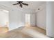 Bedroom featuring a fan, walk in closet, and a door leading to a bathroom at 222 Glenwood Avenue # 218, Raleigh, NC 27603