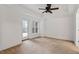 Large bedroom with neutral walls, ceiling fan, and lots of natural light at 222 Glenwood Avenue # 218, Raleigh, NC 27603