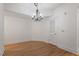 Dining room features modern chandelier and wood floors at 222 Glenwood Avenue # 218, Raleigh, NC 27603