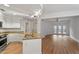 Open kitchen and living area with stainless steel appliances, and wood floors at 222 Glenwood Avenue # 218, Raleigh, NC 27603