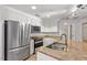 Updated kitchen with stainless steel appliances and granite countertops at 222 Glenwood Avenue # 218, Raleigh, NC 27603