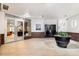 Inviting lobby with tile flooring, stylish plant, and glass doors at Glenwood at 222 Glenwood Avenue # 218, Raleigh, NC 27603