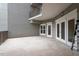 Spacious patio with access from sliding glass doors and view of the building architecture at 222 Glenwood Avenue # 218, Raleigh, NC 27603