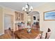 Charming dining area with hardwood floors, chandelier, and convenient access to the kitchen at 2302 Wispy Green Ln, Raleigh, NC 27614