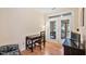 Bright office space with hardwood floors and access to a screened-in porch at 2302 Wispy Green Ln, Raleigh, NC 27614