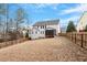 Backyard with a screened-in porch and wooden fence at 244 Winding Oak Way, Clayton, NC 27520