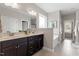 Bathroom with a double vanity, soaking tub, and natural light at 244 Winding Oak Way, Clayton, NC 27520