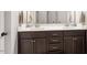 Bathroom featuring a double vanity, granite countertops, and modern fixtures at 244 Winding Oak Way, Clayton, NC 27520