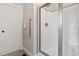 Bright bathroom with a glass-enclosed shower and tile accents at 244 Winding Oak Way, Clayton, NC 27520