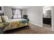 Comfortable bedroom featuring carpet floors, a TV, and an ensuite bathroom with dark vanity at 244 Winding Oak Way, Clayton, NC 27520
