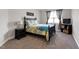 Comfortable bedroom featuring carpet floors, a dark wood bed frame and neutral-colored walls at 244 Winding Oak Way, Clayton, NC 27520