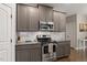 Kitchen features stainless appliances, range and granite counters at 244 Winding Oak Way, Clayton, NC 27520