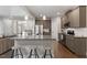 Kitchen with hardwood floors, a center island and stainless steel appliances at 244 Winding Oak Way, Clayton, NC 27520