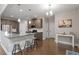 Eat-in kitchen area with hardwood floors, a center island and stainless steel appliances at 244 Winding Oak Way, Clayton, NC 27520